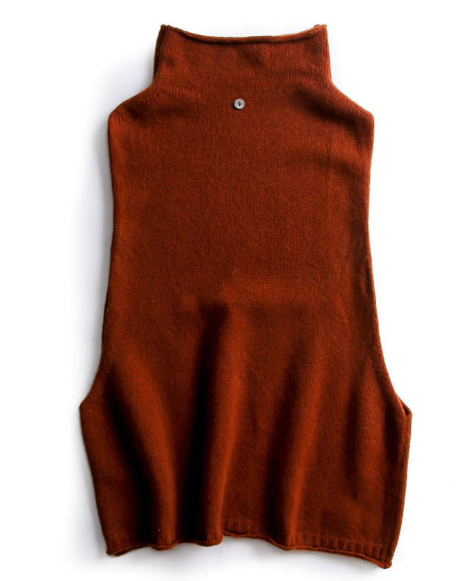 Fashionable women's sleeveless turtleneck vest top, a comfortable knit essential for layering styles.