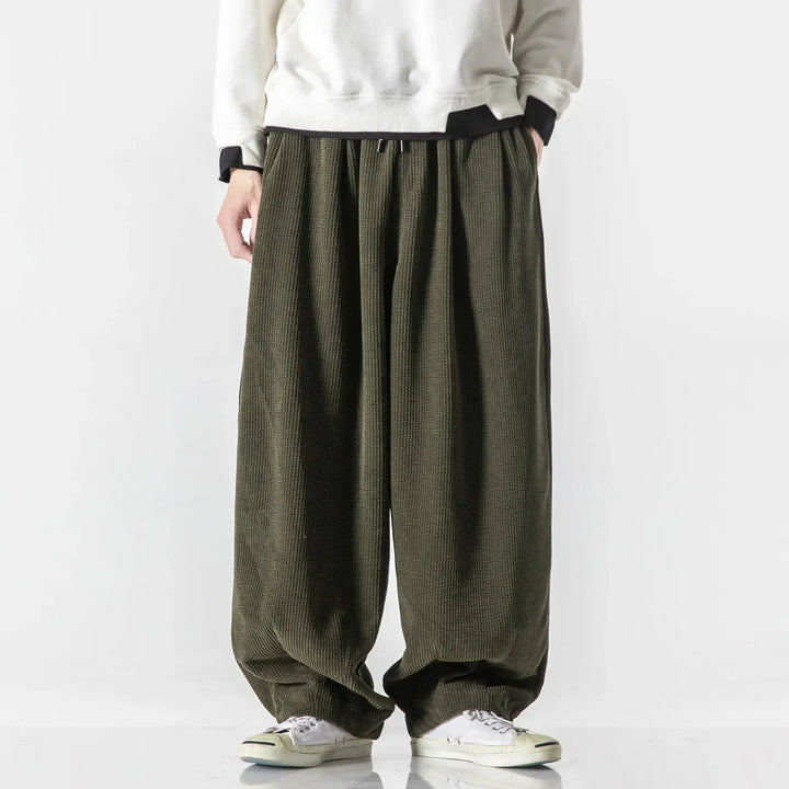 Practical unisex sweatpants with a relaxed fit, complete with convenient side pockets for essentials.