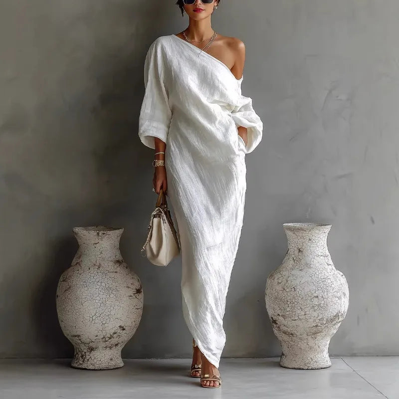 Women's elegant one shoulder asymmetrical dress with relaxed fit and batwing sleeve. Perfect for casual or party wear.