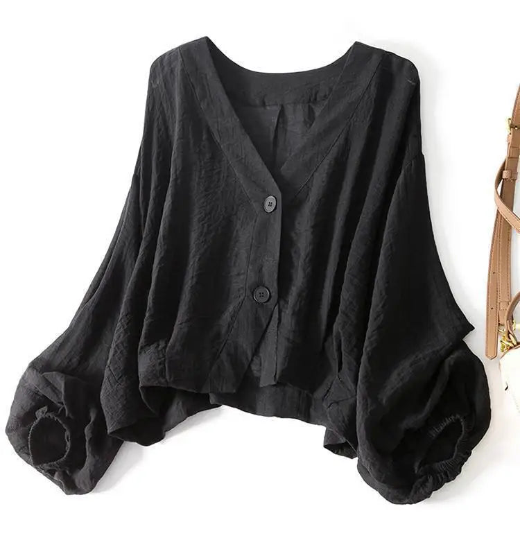 Women's lightweight flowy summer blouse with batwing sleeves, offering a relaxed and comfortable fit.