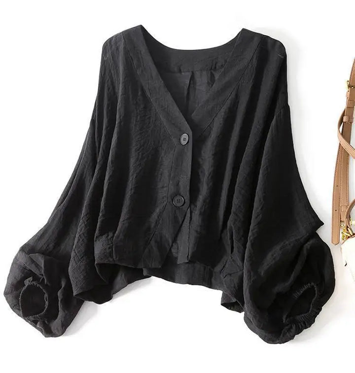 Women's lightweight flowy summer blouse with batwing sleeves, offering a relaxed and comfortable fit.