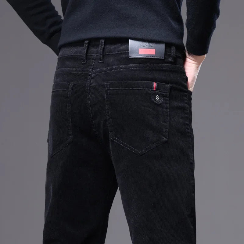 Textured premium corduroy dress trousers, showcasing luxurious drape & tailored fit for men.