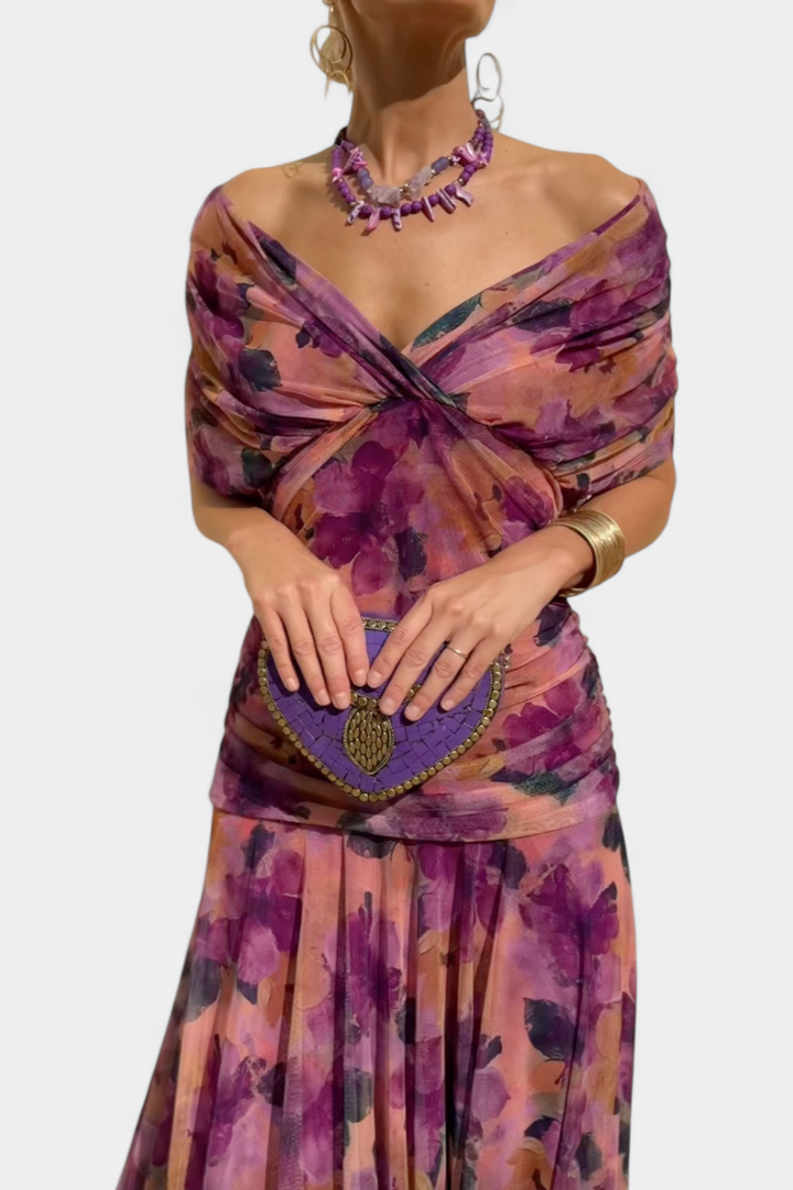 Stylish women's off-shoulder midi dress, featuring ruched fabric and a unique twist-front.