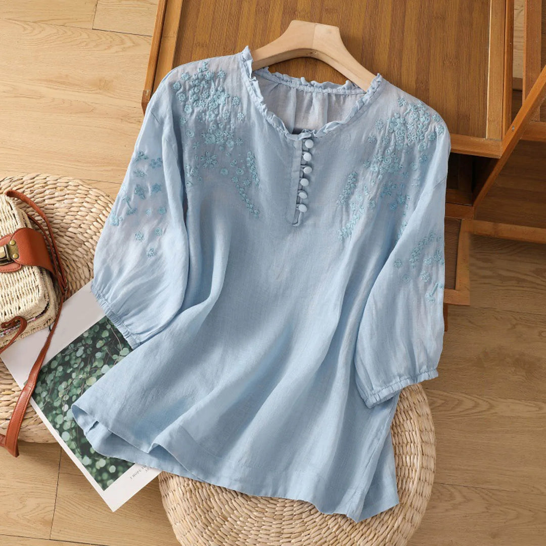 Women's elegant embroidered blouse with a button front, loose fit, and elbow sleeves. Perfect for spring and summer fashion.