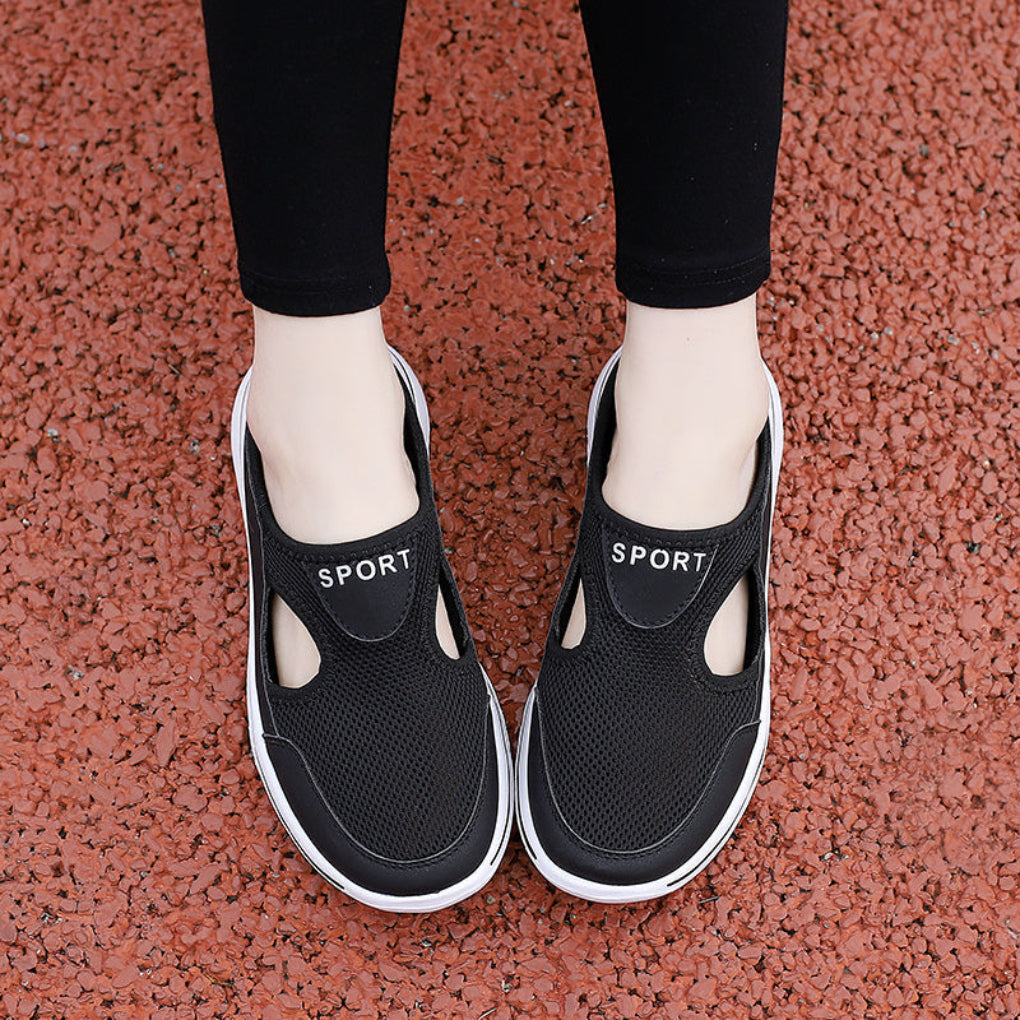 Cozy slip-on orthopedic slippers providing foot support & comfort for men & women at home.