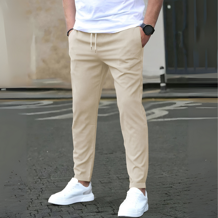Comfortable men's slim fit drawstring pants with an adjustable waist, ideal for everyday style and comfort.
