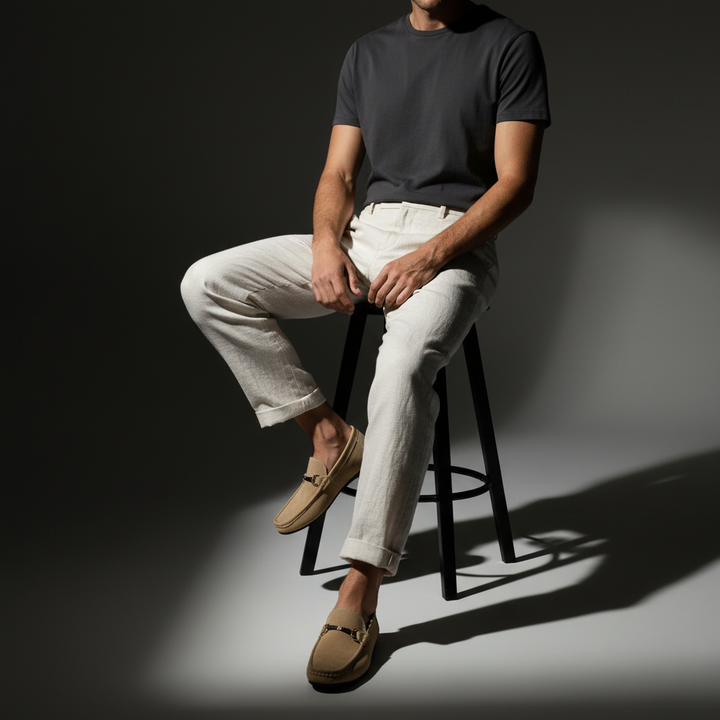 Classic men's loafers showcasing a polished metal buckle. Stylish slip-on shoes for modern men's fashion.