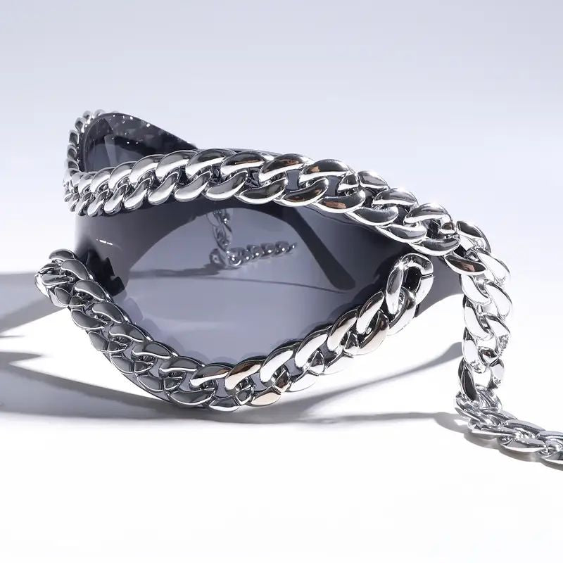 Close-up of unisex mirrored sunglasses showing unique chain accent & stylish design.
