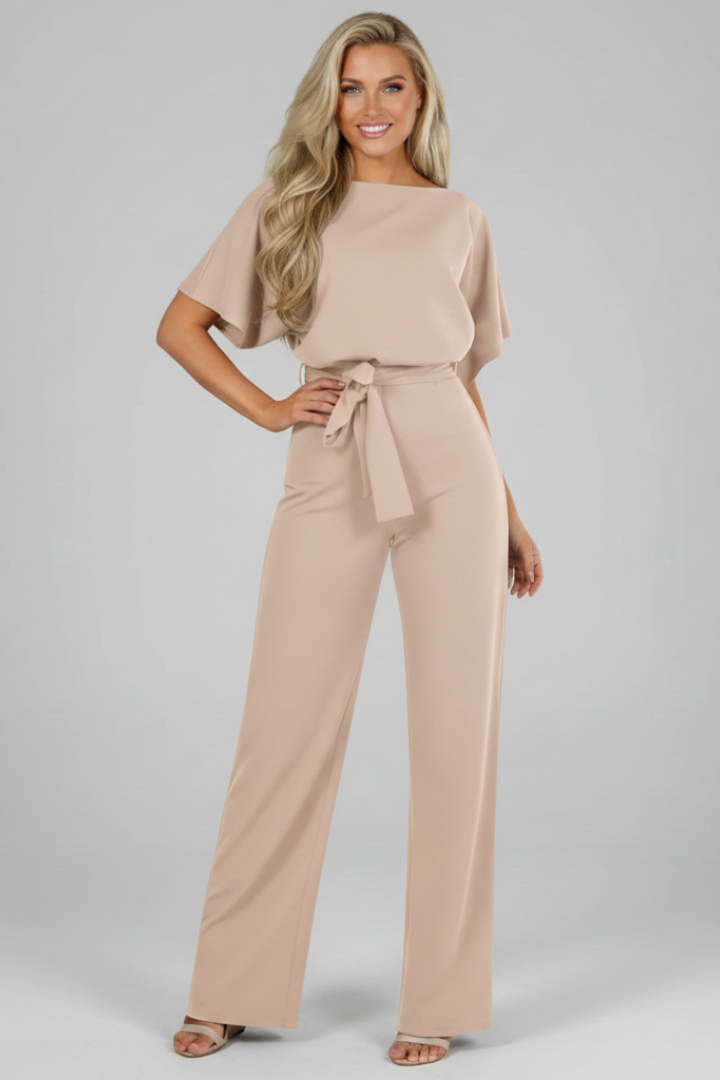 Close-up of adjustable waist tie on a women's short sleeve jumpsuit. Enhances the chic, casual elegant, everyday fashion look.