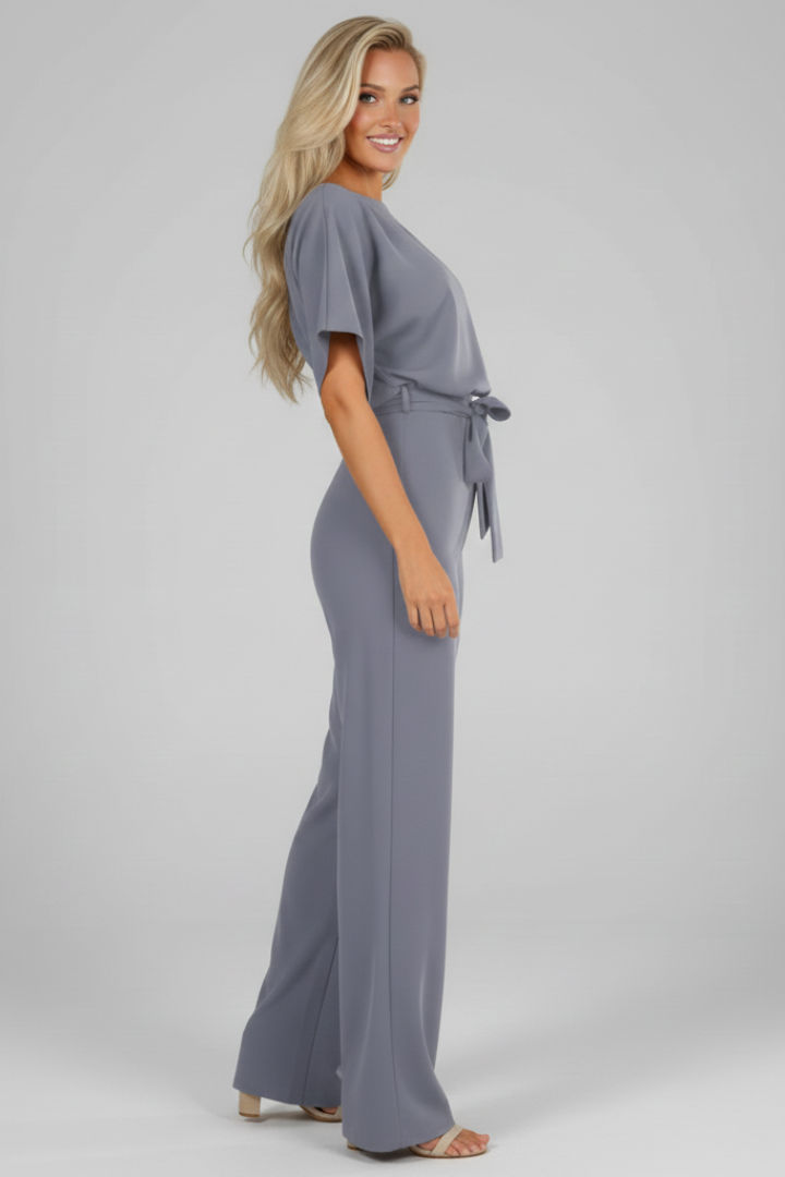 Fashionable women's short sleeve jumpsuit with a straight leg & waist tie detail. Versatile, full-length, casual elegant wear.