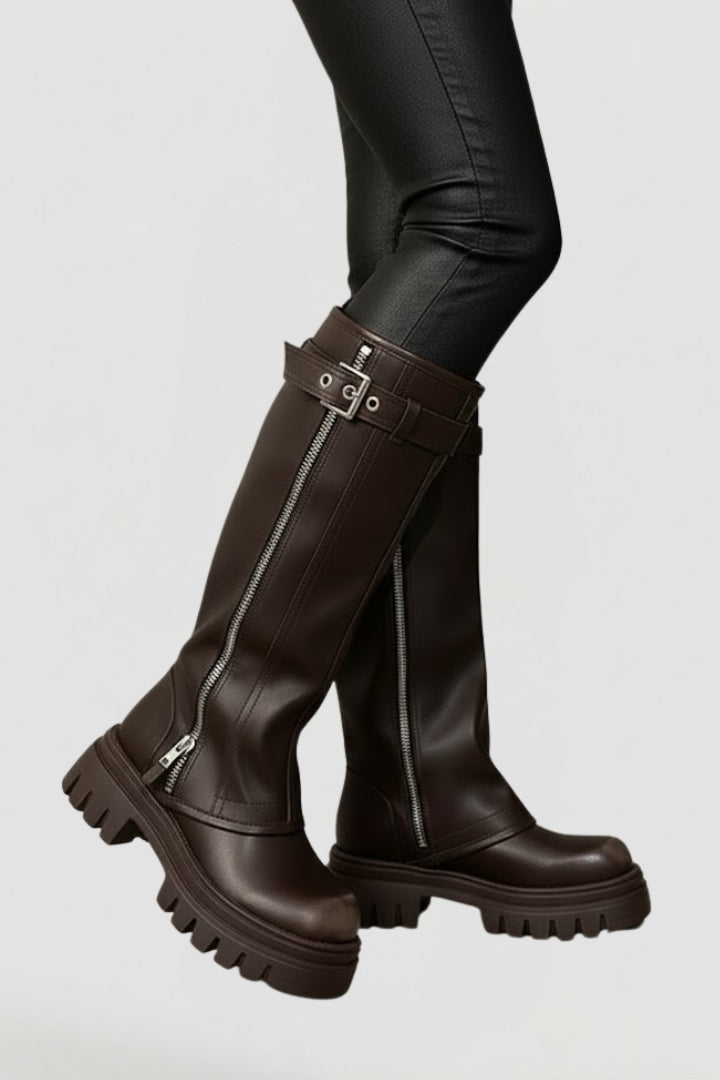 Elegant brown knee-high platform boots for women, featuring a classic round toe. Stylish and comfortable winter footwear.