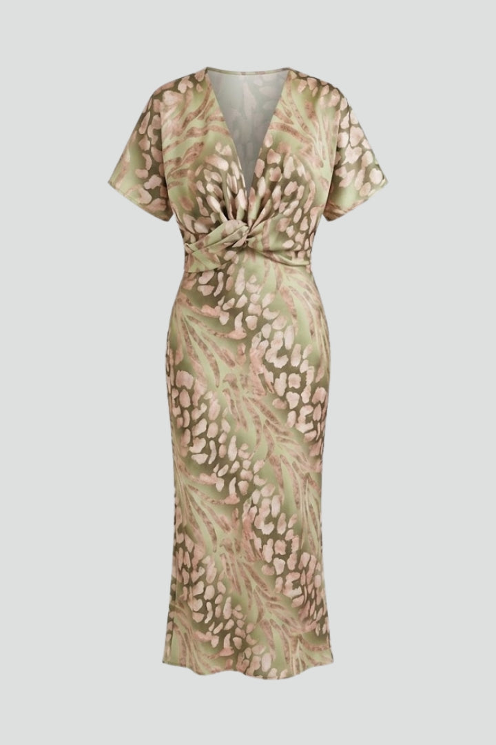 Elegant women's green floral V-neck midi dress with pleated hem, perfect for summer garden parties.