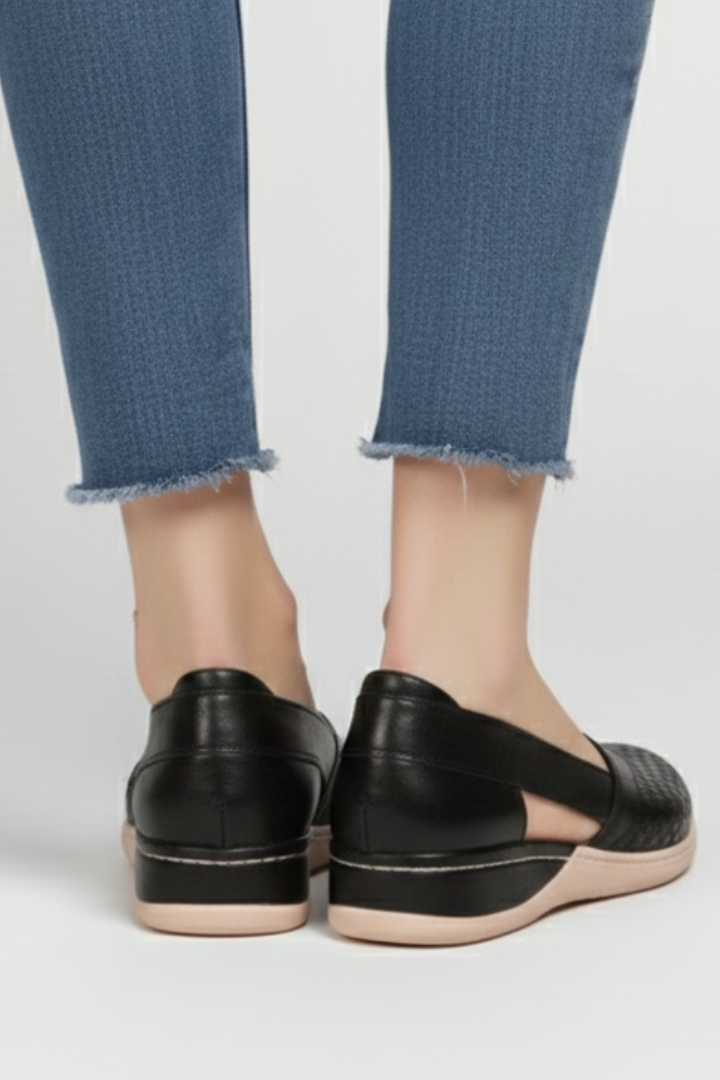 Comfortable women's walking shoes with breathable cut-outs and a durable, sturdy sole for everyday.