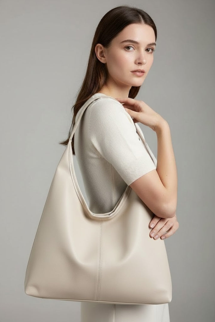 Women's everyday shoulder bag, chic & spacious, perfect for daily carry. Secure top zipper handbag.