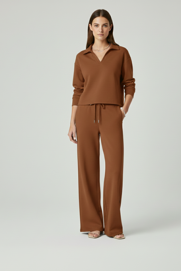 Loose fit women's lounge set: long sleeve v-neck top & wide-leg pants, perfect for relaxing.