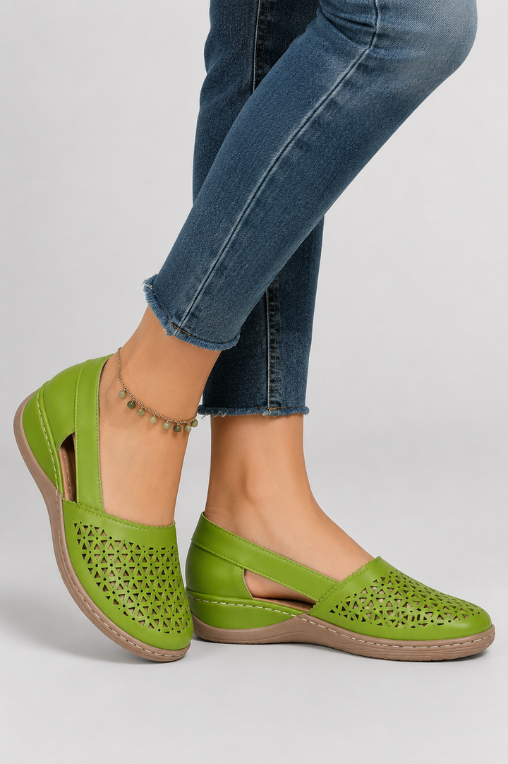 Women's spring/summer shoes, comfy flats with decorative cut-outs and a reliable sturdy sole.