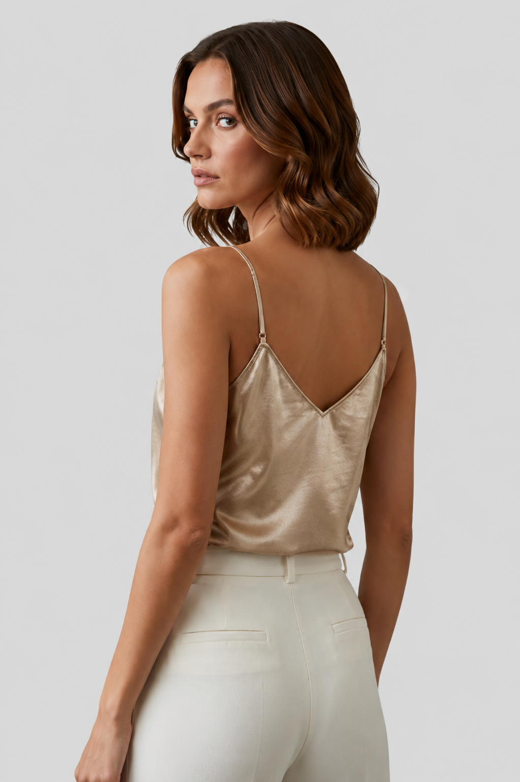 Stylish women's V-neck blouse with delicate thin straps, ideal for warm weather fashion.