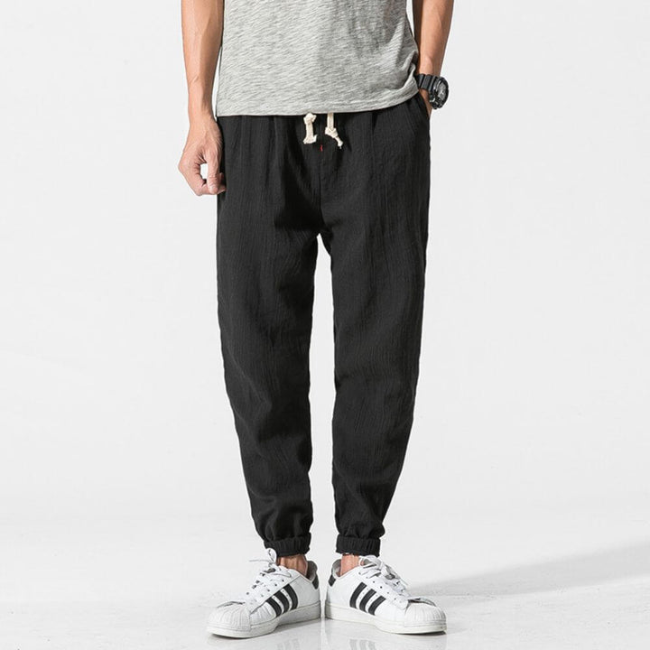 Men's drawstring casual joggers, breathable fabric, great for summer wear.