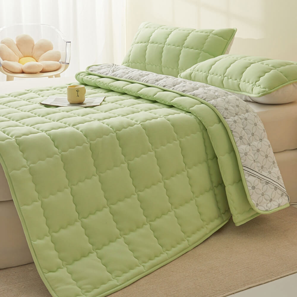Close-up of the breathable quilted surface of the all-season mattress topper, highlighting stitching
