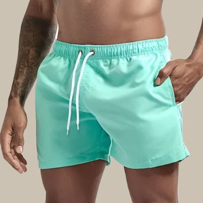 Above-knee men's swim shorts with drawstring, relaxed fit for ultimate comfort.