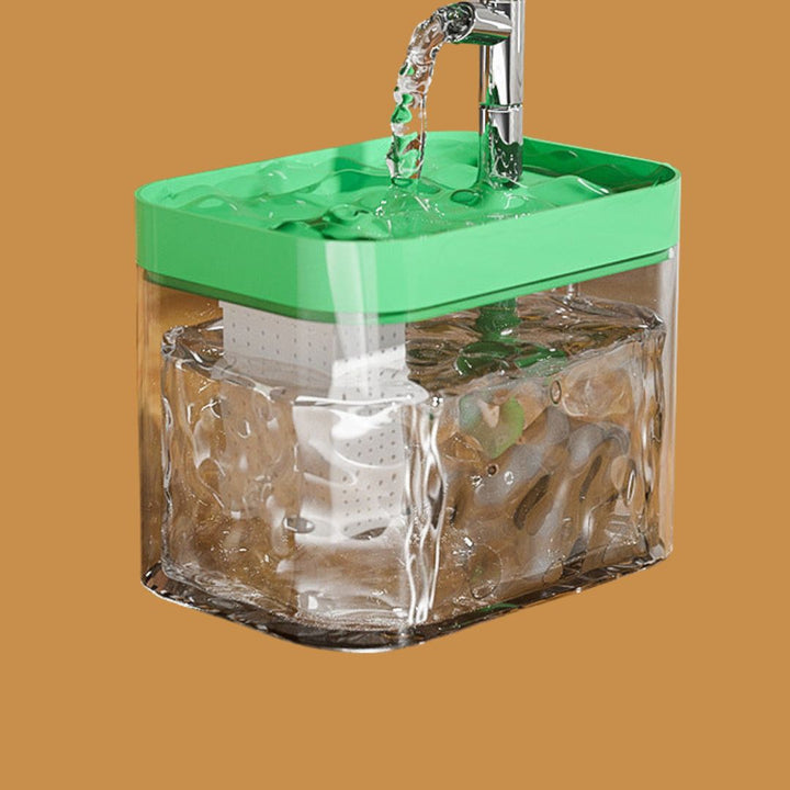 Automatic pet fountain with a cat drinking from it, demonstrating its use and quiet operation.