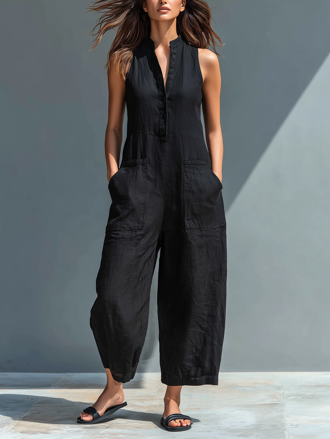 Black women's sleeveless loose-fit jumpsuit, perfect for comfortable casual wear & effortless summer style.