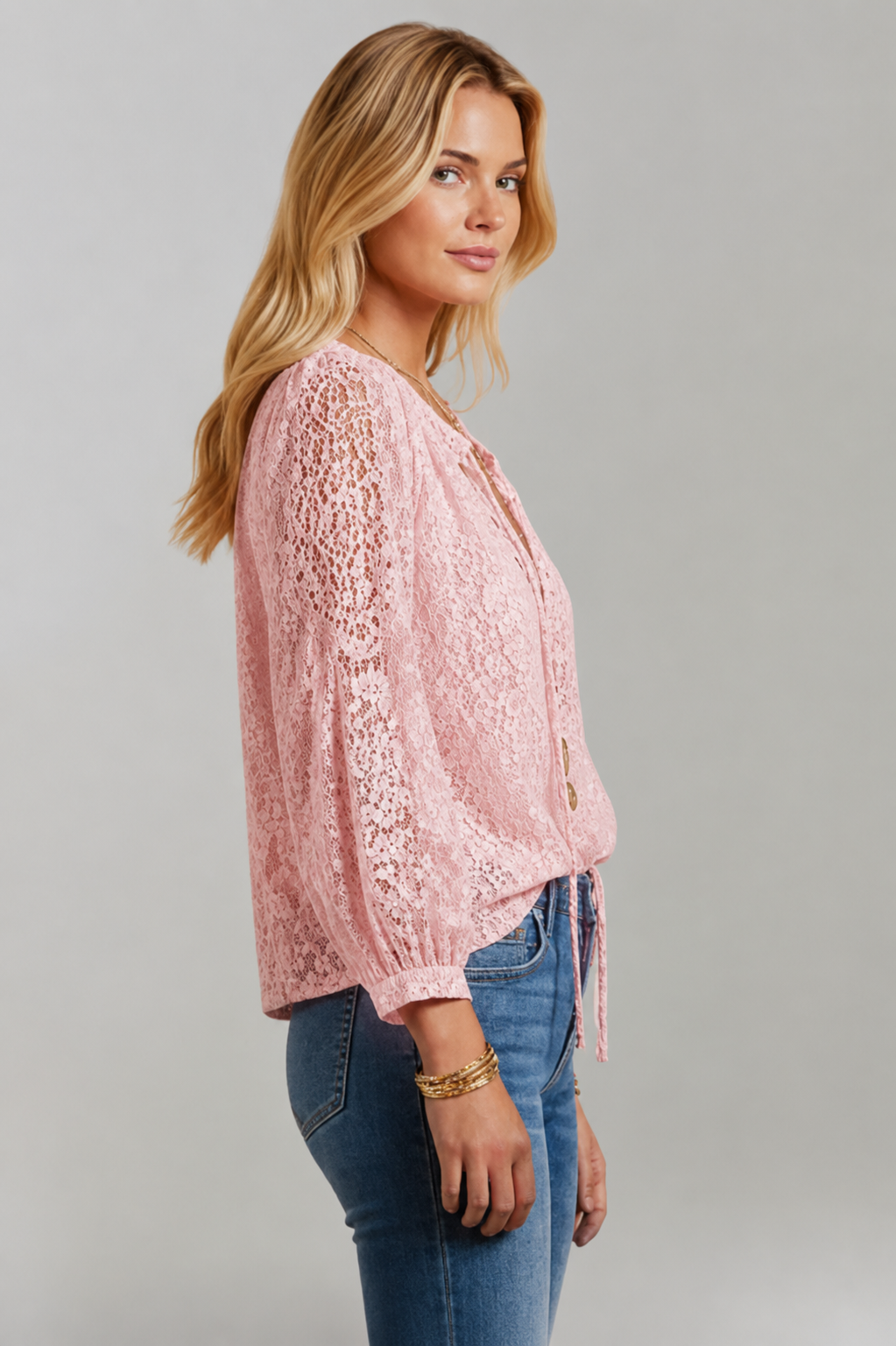 Stylish women's long sleeve lace blouse. Elegant design with a tied neckline, perfect for feminine fashion.