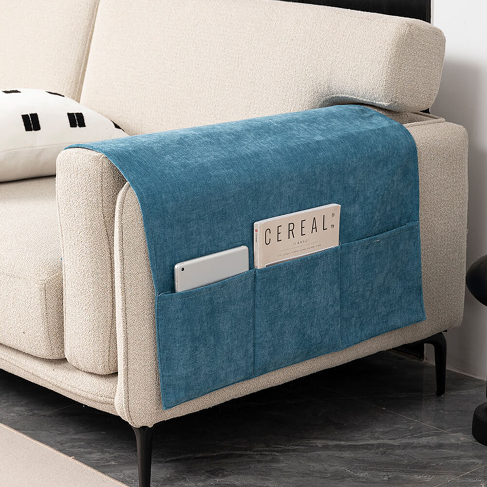 Chenille sofa armrest cover with 5 storage pockets on a grey couch, protecting furniture