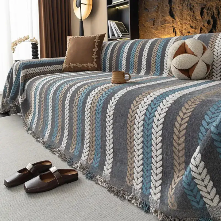 Durable chenille furniture protector featuring a detailed leaf pattern, enhancing sofa seating.