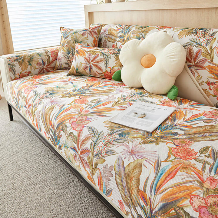 Sectional couch cover featuring chic tropical leaves, non-slip backing, provides summer comfort