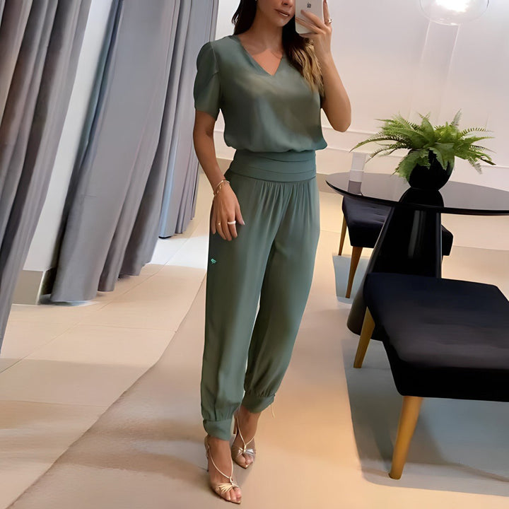 Trendy women's two-piece outfit featuring a fashionable blouse and matching pants, great for stylish ladies apparel.