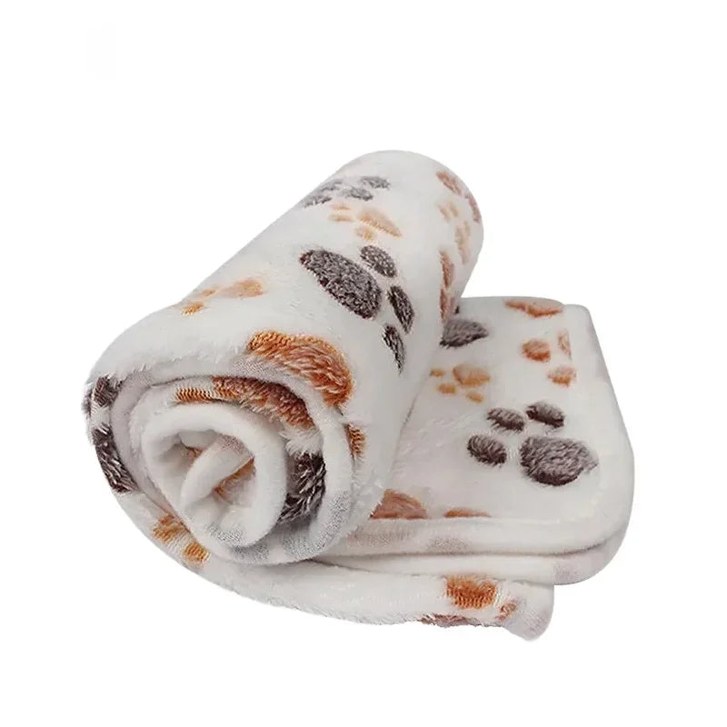Compact coral fleece pet blanket, ideal as a travel blanket or crate mat for small to medium pets.