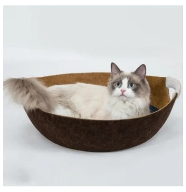 A cozy cat bed crafted from soft felt material, providing a warm and secure pet basket.