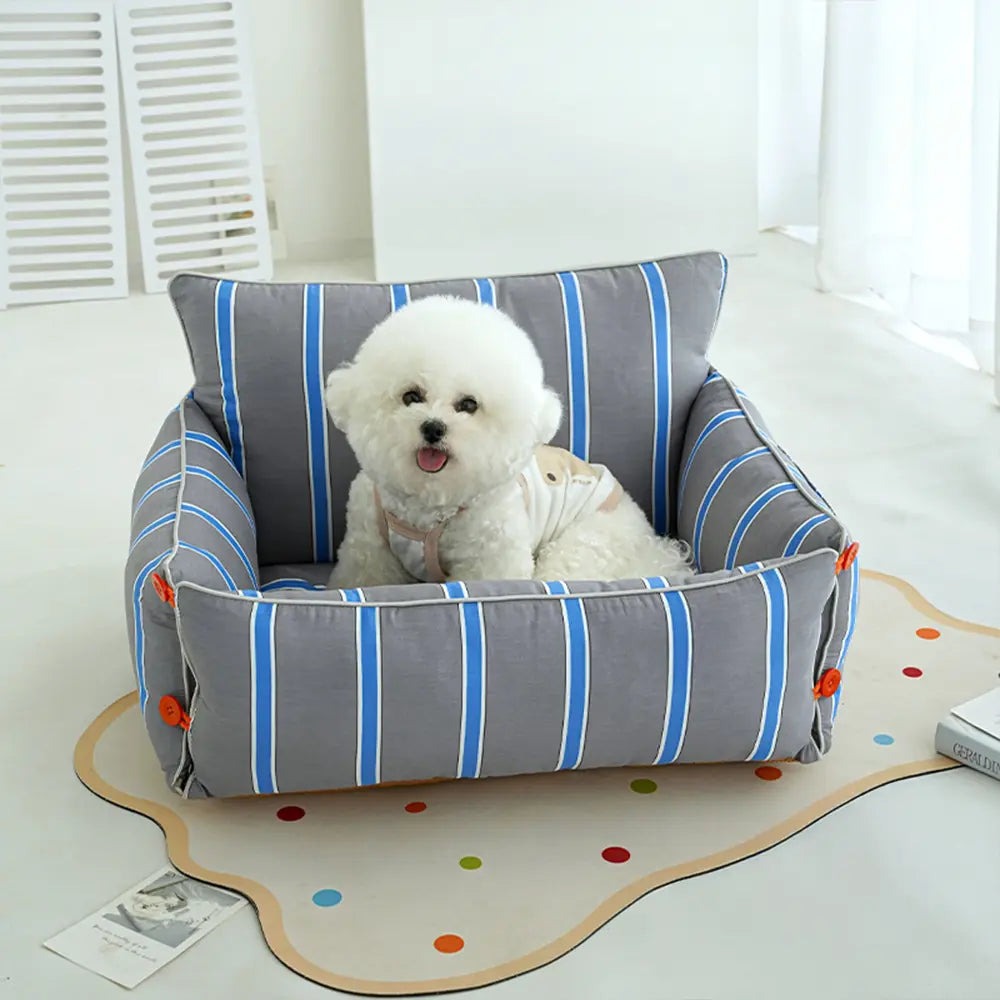 Cozy raised dog sofa bed for comfortable pet rest. Washable non-slip dog furniture.