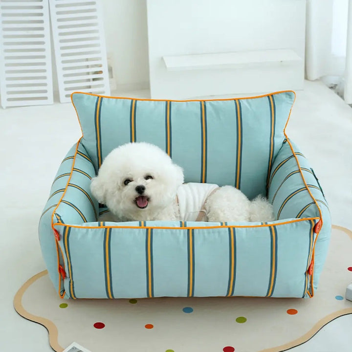 Plush raised pet sofa bed with cushioning, ideal for small to medium dogs. Washable pet comfort furniture.