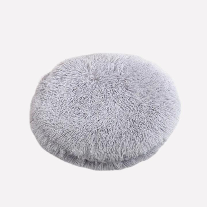 Round plush pet bed blanket for cats, warm and cozy, ideal for relaxation.