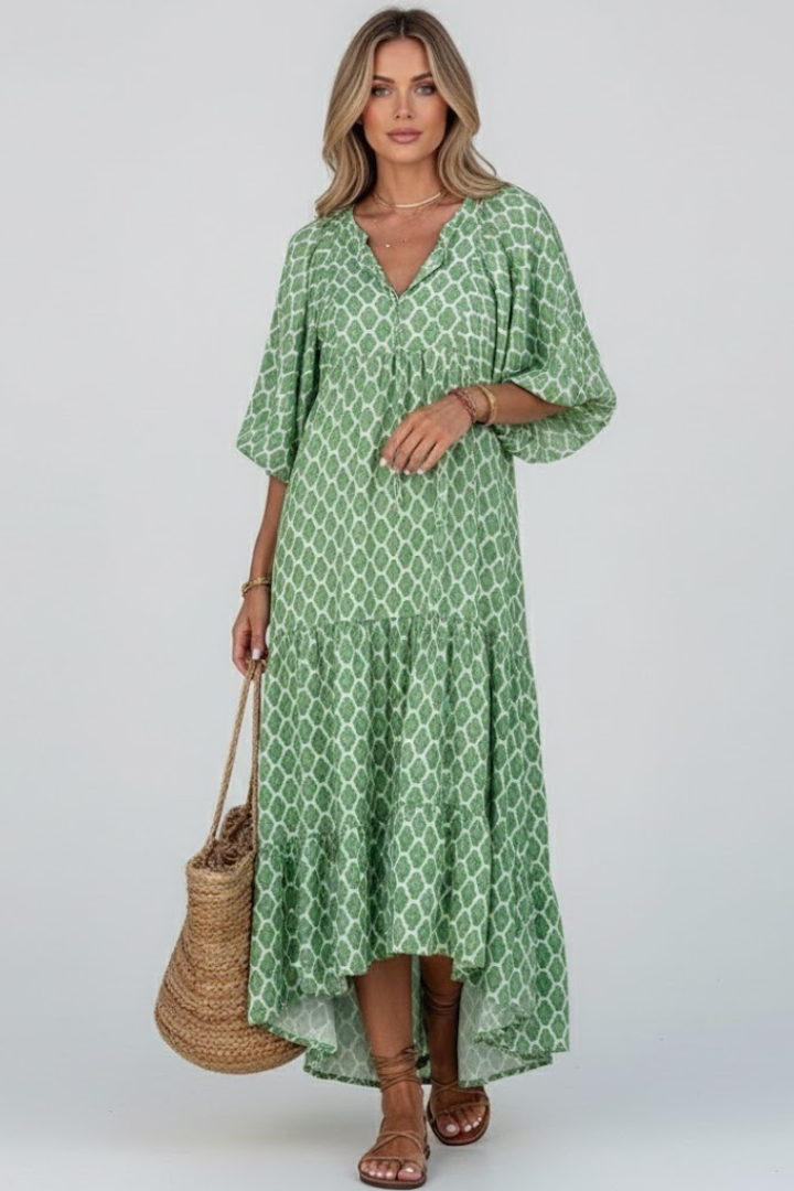Light green printed V-neck long summer dress. Relaxed fit, comfortable, and flowy with a layered skirt.