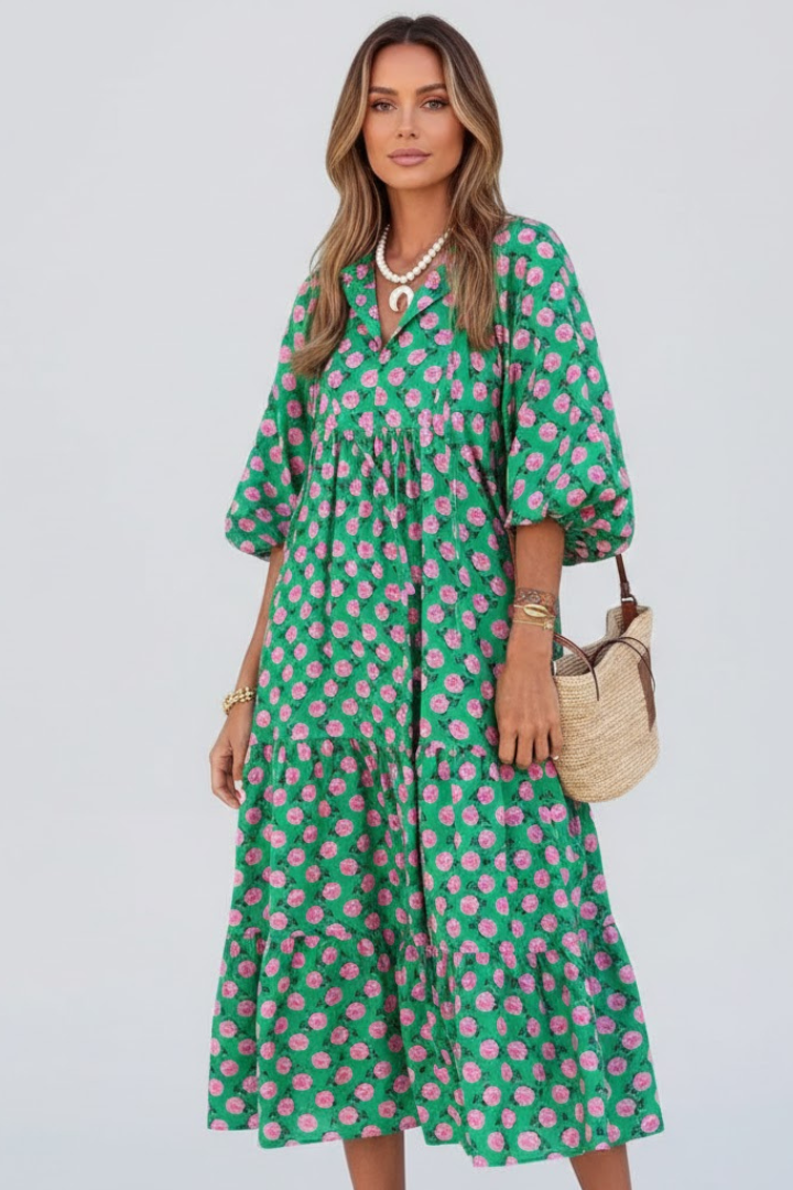 Elegant light green V-neck summer dress with a flowy layered skirt. Comfortable, short sleeve, and casual.