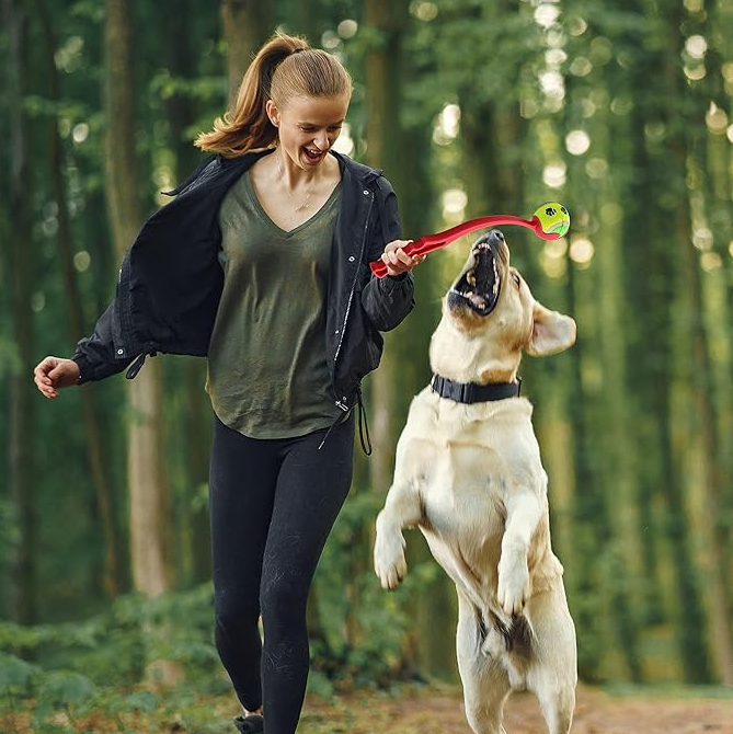 Close-up of the ergonomic handle on a dog ball launcher, designed for easy pet fetch.