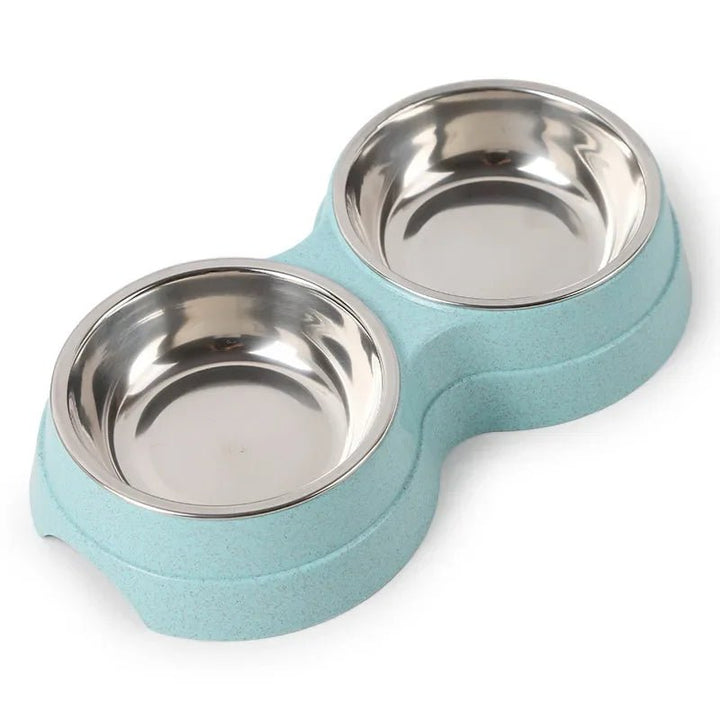 Two stainless steel food and water bowls for pets on a non-slip stand, ideal for dogs and cats.