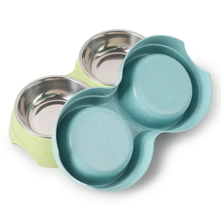Durable double feeder with stainless steel bowls for pet food and water, non-slip base.