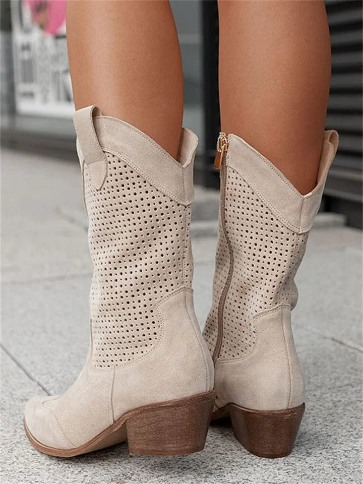 Women's western boots with a comfortable block heel, side zip, & fashionable perforated details, perfect for any outfit.