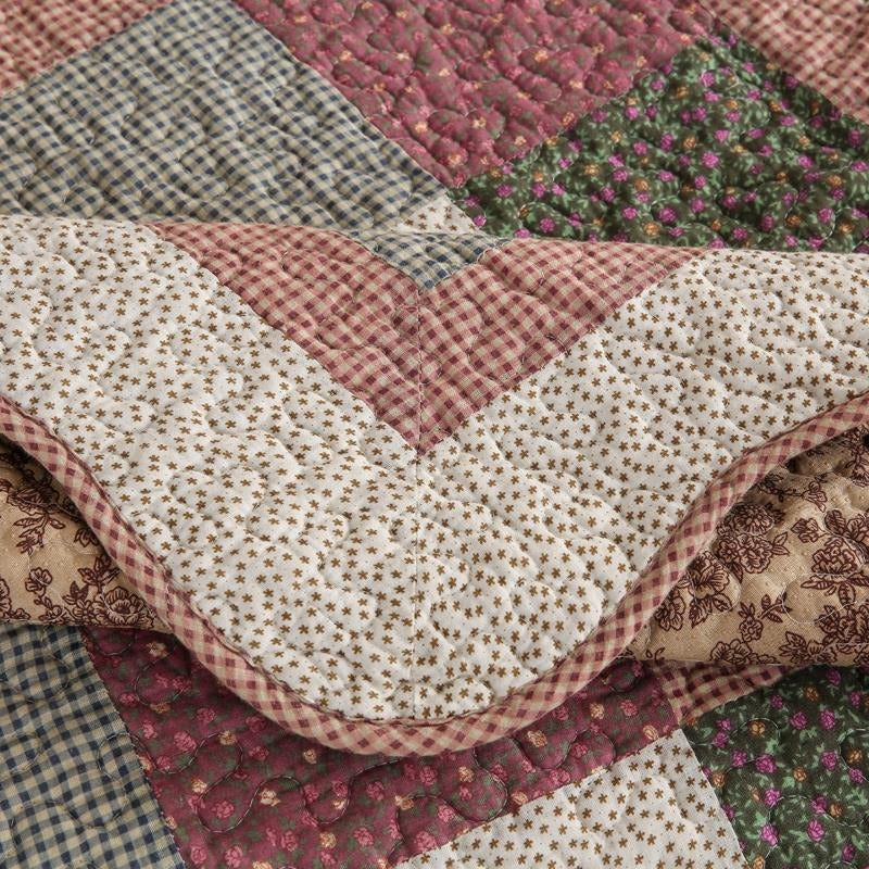 Pet-friendly quilted cotton couch cover for a sectional sofa. Spill-resistant & washable furniture protector.