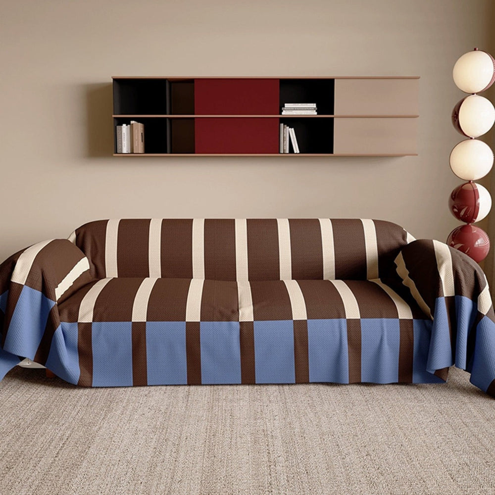 Contemporary striped sofa cover. Memphis style couch protector for a modern, pet-friendly living room.
