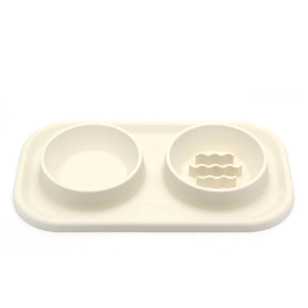 Non-slip pet slow feeder dual bowl with silicone mat & stainless steel inserts for improved dog/cat digestion.