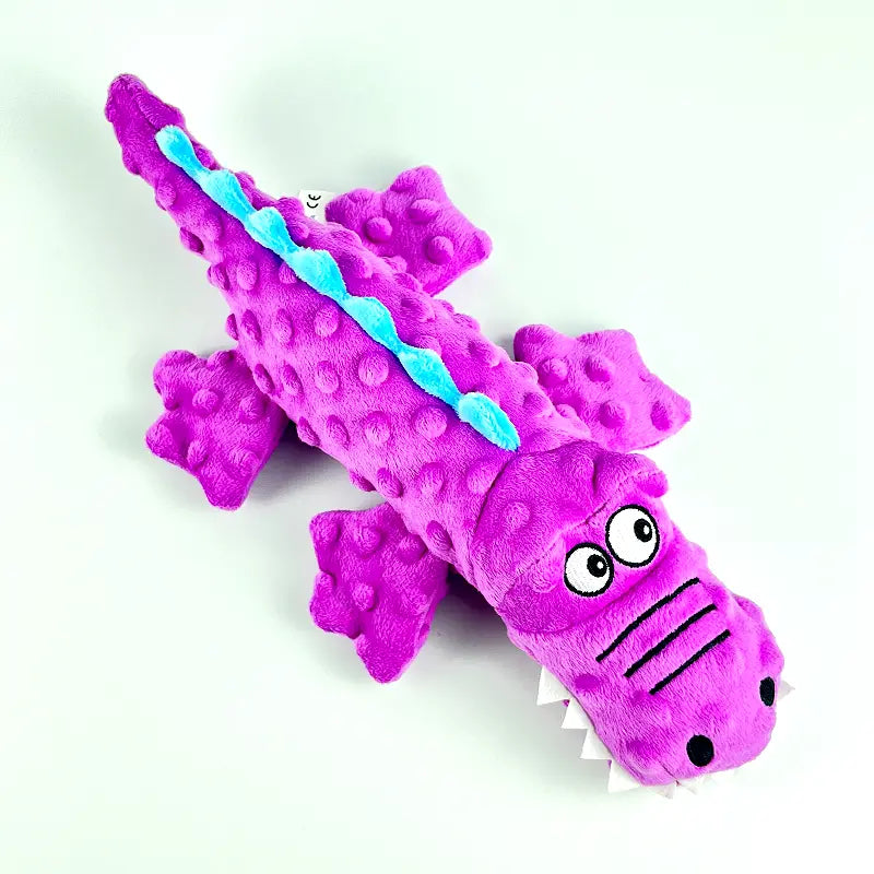 Ergonomic durable crocodile dog toy, green plush with chew guard, ideal for medium to large breeds.