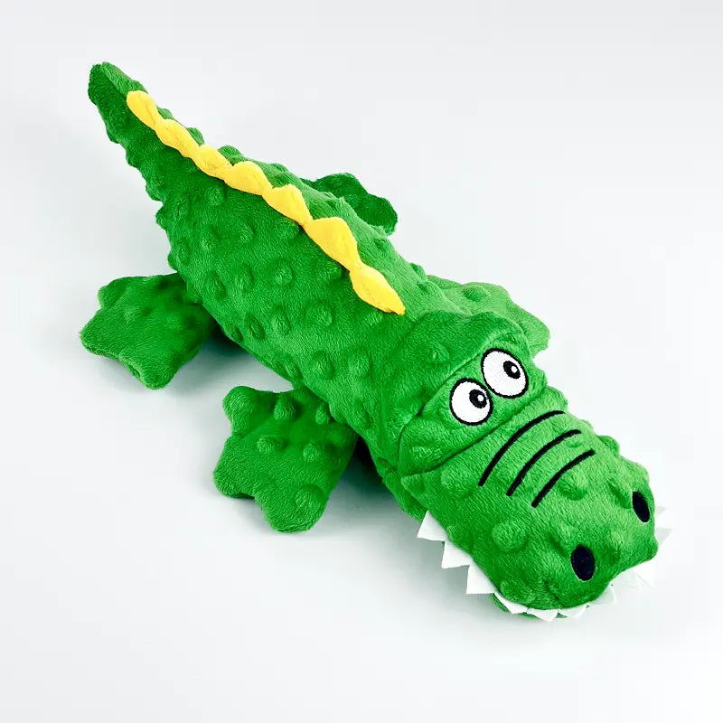 Robust green crocodile dog chew toy, plush and squeaky, built for tough play.