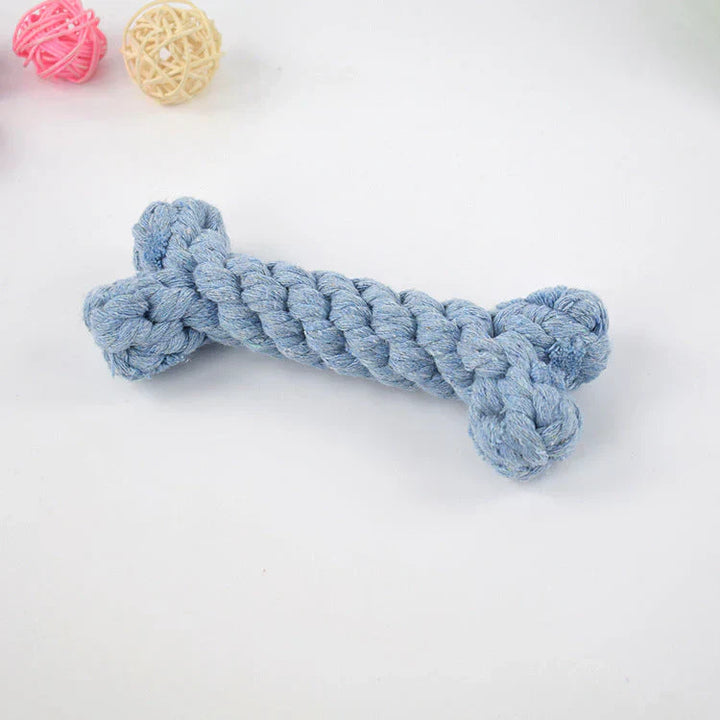 Dog happily chewing on a blue dental toy, showcasing its effectiveness for plaque and tartar removal