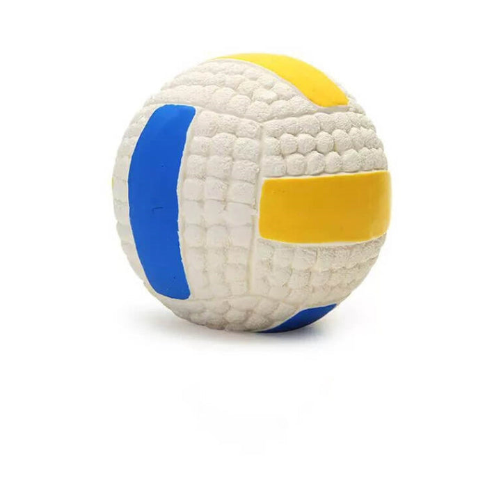 Puppy chewing on a durable latex squeaky ball toy, promoting healthy dog dental play