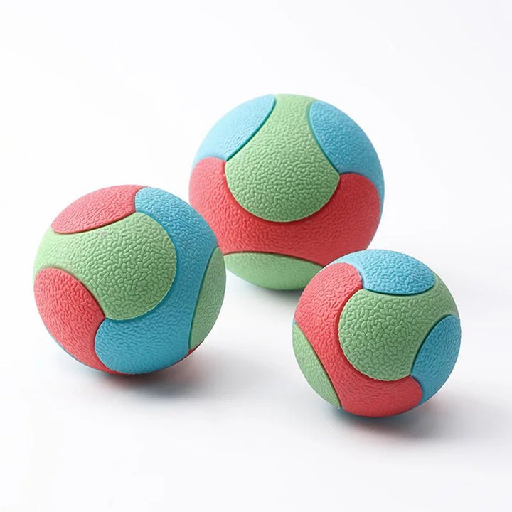 Close-up of textured chew toy, a rubber bouncy ball for dog dental care and play